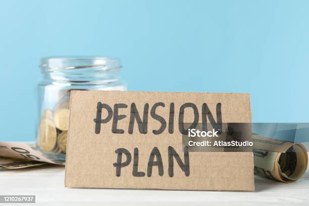 Inscription Pension plan and jar with money against blue background, close up